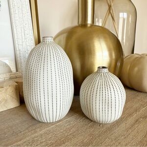 set of black and white dotted vases